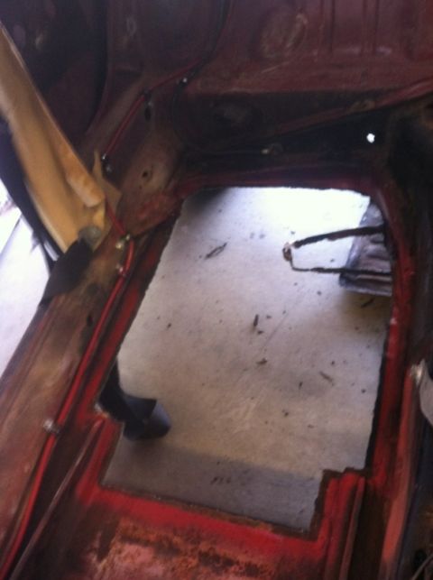 1970 Volkswagen Beetle - The interior floor pan of a vehicle shows signs of modification and repair work in-progress work.