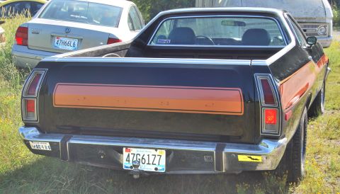 1975 Ford Ranchero - Rear view of a 1975 Ford Ranchero pickup truck, showing its distinctive tailgate stripe.