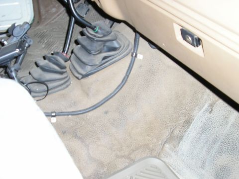 1986 Ford Bronco - Interior view of the floor area with shifter boots in a 1986 Ford Bronco.