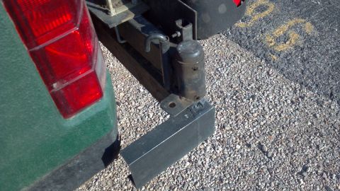 1986 Ford Bronco - Close up of a hinge unit. Purchased from comp4x4.com, it supports the weight of the spare tire or jerry cans cooler just fine.