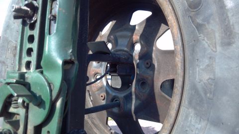 1986 Ford Bronco - Rear view of the spare tire mount. Some parts came off the stock Bronco spare tire carrier, I just mounted it to my bumper and post.