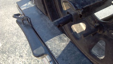 1986 Ford Bronco - With the locking pin removed, the light is un-plugged, and the whole bracket slides out.