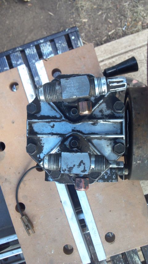 1986 Ford Bronco - Looking down on the York. The fitting on the left is the intake, and I tapped it out for 1/8 NPT. The fitting on the right is the discharge…