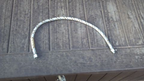 1986 Ford Bronco - 24" flexible oil line. I went with the braided steel line as the discharge side of the compressor can get very hot.