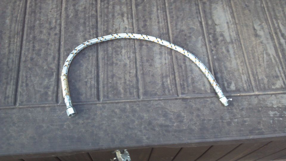 24" flexible oil line.  I went with the braided steel line as the discharge side of the compressor can get very hot.