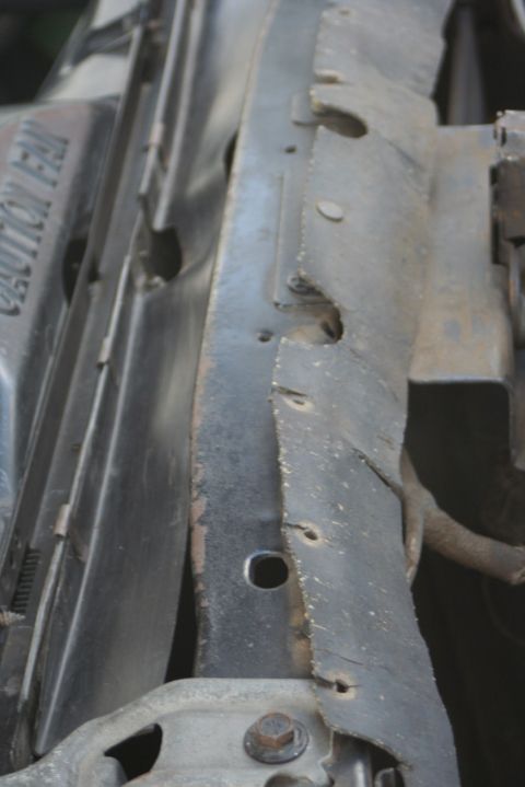 1976 Ford Ranchero - Close-up of the radiator support in the engine bay of a 1976 Ford Ranchero, showing the 'Caution Fan' warning text.
