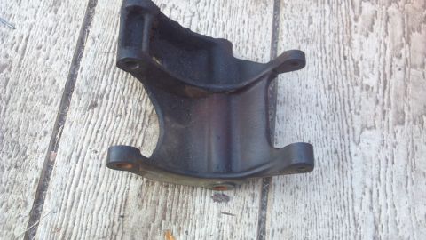 1986 Ford Bronco - Original smog bracket. My custom bracket attaches to the two upper tabs.