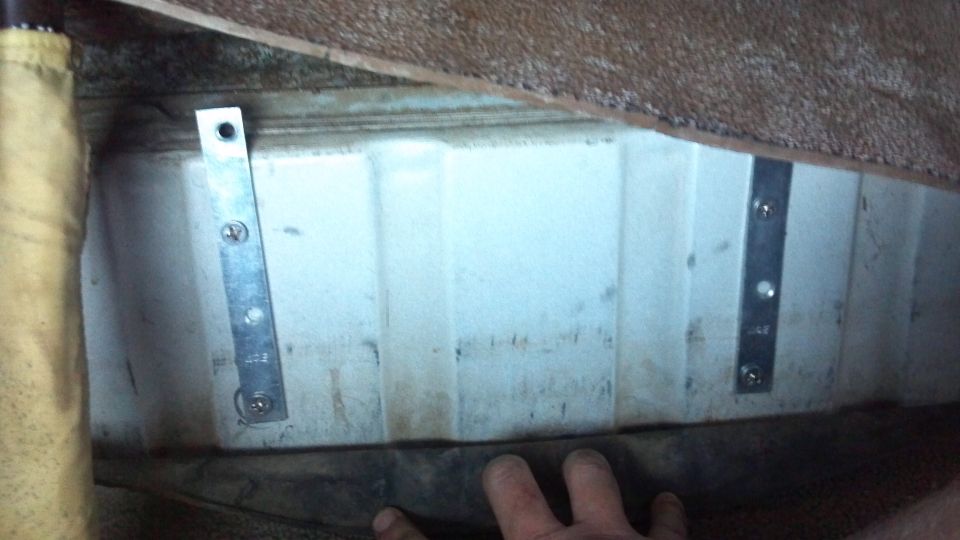 These backing plates support the air tank.  This is the hump under the rear seat.