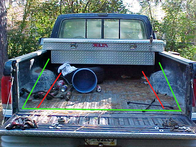 Rear view of a 1989 Ford F-150 pickup truck bed with a Delta toolbox