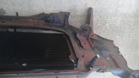 1973 Chevrolet Camaro - Close-up of a rusty radiator and its support structure, showing signs of wear and age.