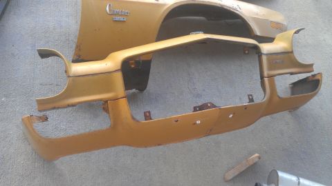 1973 Chevrolet Camaro - Gold 1973 Chevrolet Camaro fender and bumper assembly, showing rust and damage.