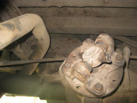 1994 Ford Bronco - Underside view of a vehicle's drivetrain, focusing on the driveshaft connection to the differential.