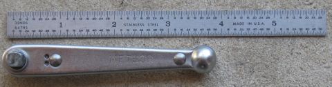 2000 Ford Crown Victoria - A Meteor brand ratchet wrench is shown next to a ruler for scale.