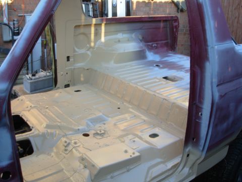 1983 Ford Bronco - Nice weather today, so I degreased the body, pressure-washed it, dried it, and then started spraying the Rustoleum Sand 7771 .
