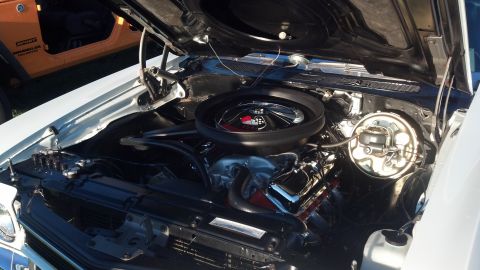 2007 Ford Mustang - A close-up view of a classic car's engine compartment, polished components and an open hood.