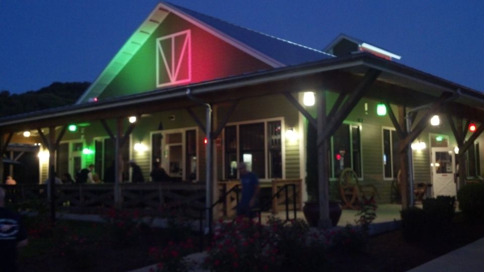 Building with red and green lights at dusk