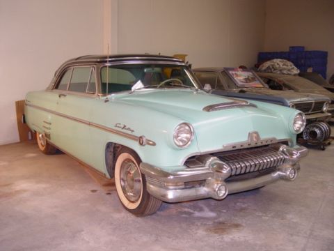 1954 Mercury Monterey - A light blue 1954 Mercury Monterey Sun Valley coupe is parked in a garage with another vehicle behind it.