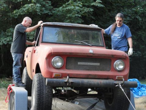 1966 International Scout 800 - The front grille of an old International pickup truck has the brand name visible.