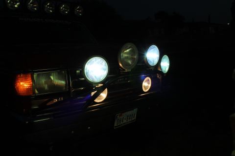 1990 Ford Bronco - The front grille of a 1990 Ford Bronco is illuminated by several auxiliary lights.