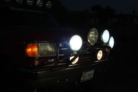 1990 Ford Bronco - 1990 Ford Bronco front end with auxiliary lights and "ROUGH COUNTRY" banner.