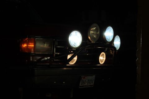 1990 Ford Bronco - This vehicle is equipped with several powerful auxiliary lights, illuminating the front end at night.