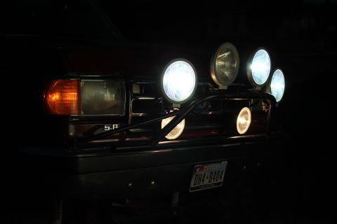 1990 Ford Bronco - This 1990 Ford Bronco features a bull bar with multiple auxiliary lights illuminating the front grille.