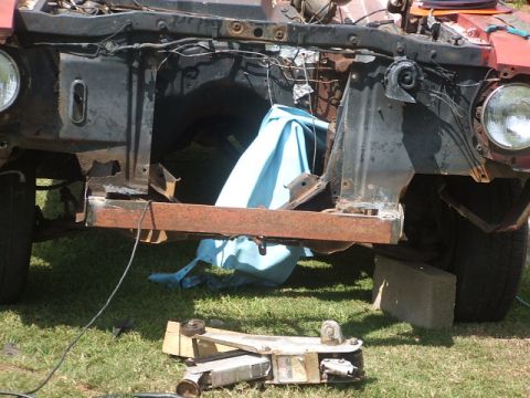 1966 Ford Ranchero - Vehicle front end undergoing construction, with visible rust and exposed components.
