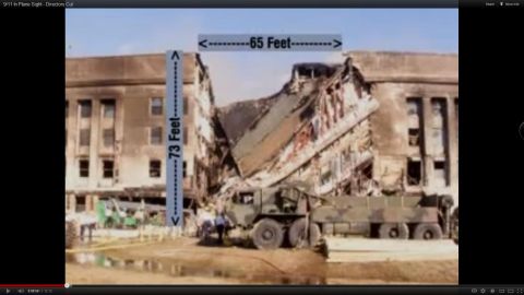 1991 Eagle Talon - A military truck is parked in front of a heavily damaged building, with dimensions indicated on the structure.