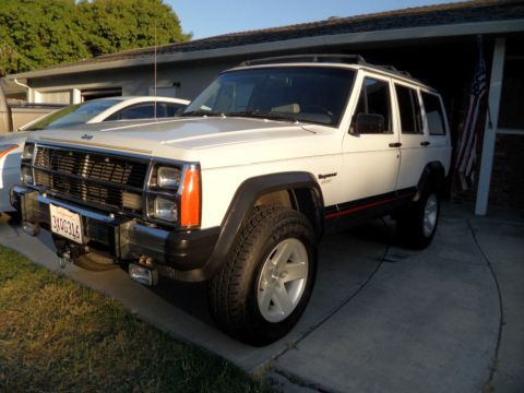 1994 Jeep Cherokee - This 1994 Jeep Cherokee is shown in a 3q-front view, parked in a driveway.