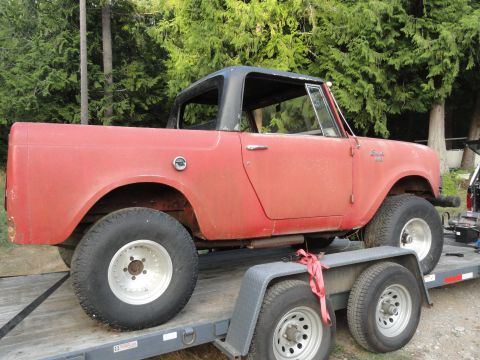 1966 International Scout 800 - A red 1966 International Scout 800 is seen on a trailer, ready for transport.