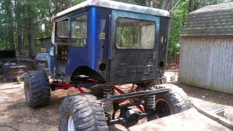 1978 Ford Bronco - This heavily modified vehicle features oversized tires and a custom suspension system, suggesting it's built for off-road use.
