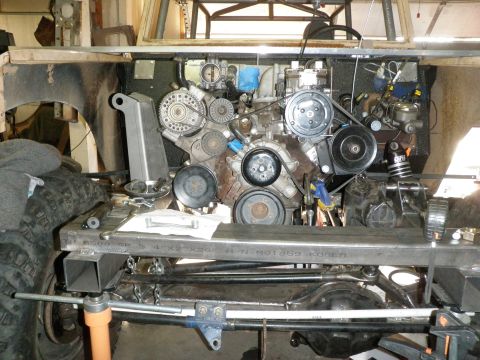 1961 International Scout 800 - Close-up view of an engine and chassis components during installation or modification.