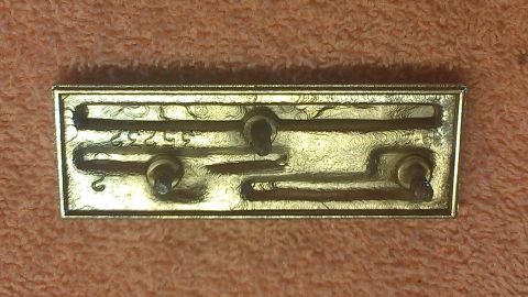 1973 Chevrolet Camaro - Rear view of a car emblem, showing mounting posts and part number 35252.