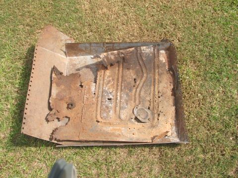 1966 Ford Ranchero - This heavily rusted floor pan section is a part of a vehicle's undercarriage.