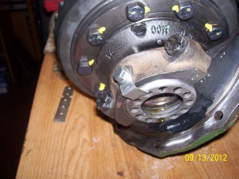 1990 Ford Bronco - Close-up of a vehicle differential housing with visible bolts and markings.