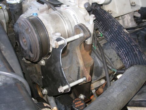 1997 Chevrolet Silverado 3500 - I started with an Aluminum template, then made this steel bracket. The lower 2 short bolts came from the holes where the long bolts are now…