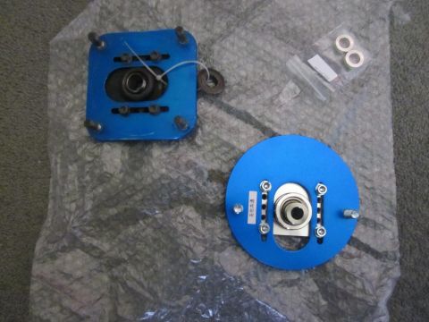 1993 Mazda MX-3 - Pair of blue adjustable strut mounts with hardware. The round mount has Japanese text on a label.