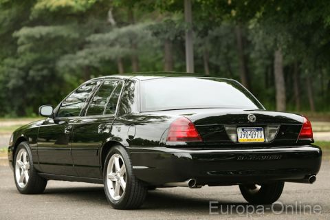 2003 Mercury Marauder - Rear 3/4 view of a black 2003 Mercury Marauder sedan parked outdoors.