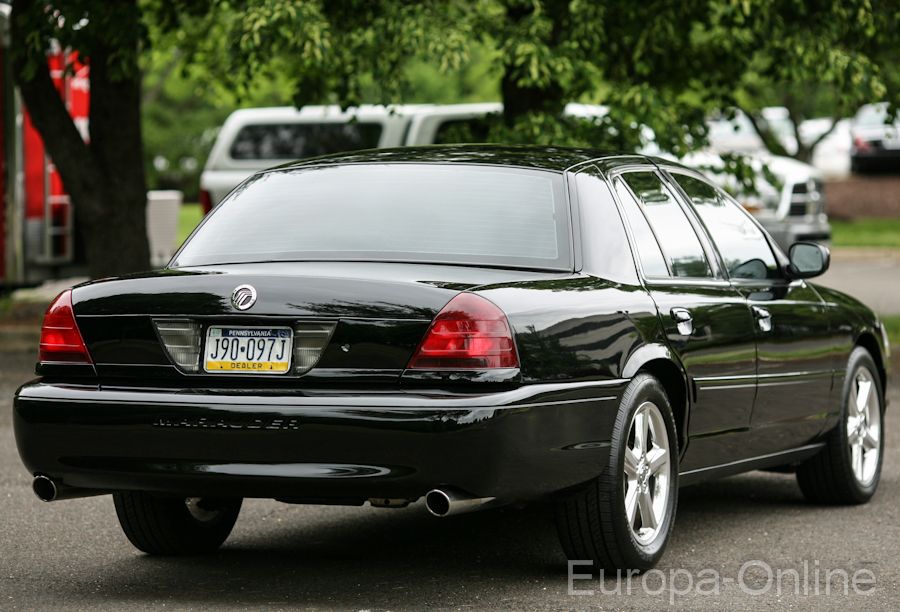 Black 2003 Mercury Marauder parked, showing rear and side profile. License plate J90-097J