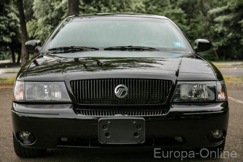 2003 Mercury Marauder - Frontal view of a black 2003 Mercury Marauder sedan parked outdoors.