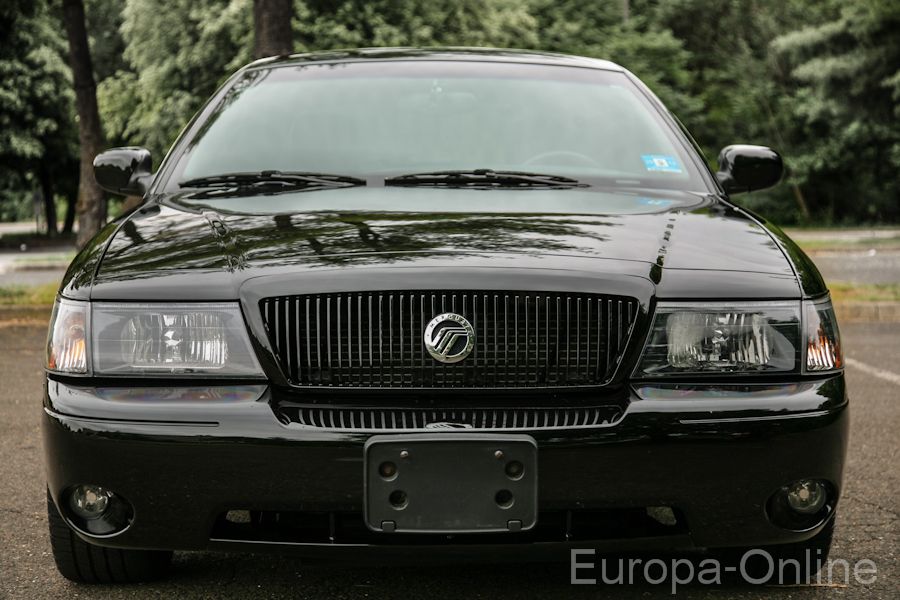 Front view of a black 2003 Mercury Marauder with a vertical slat grille and Mercury emblem