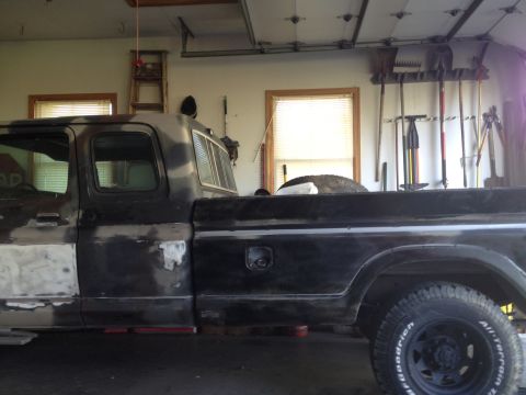 1979 Ford F-350 - This 1979 Ford F-350 pickup truck is shown in a garage, with visible bodywork and repairs in progress.