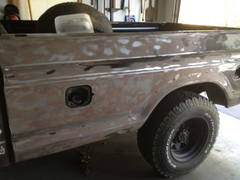 1979 Ford F-350 - The truck's body is prepped for paint, with the fuel filler door removed for access.