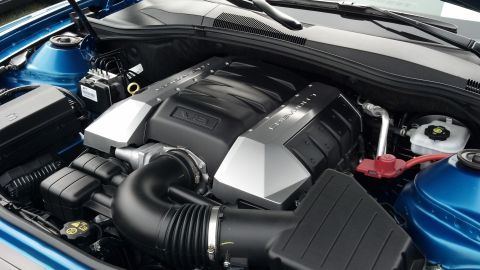 2007 Ford Mustang - Close-up of a Chevrolet V8 engine bay, showing the engine covers and intake system.