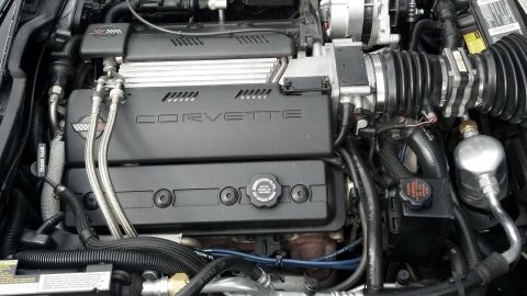 2007 Ford Mustang - Close-up view of a Corvette engine, showing the prominent "CORVETTE" branding on the engine cover.