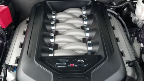 2007 Ford Mustang - The engine bay features a prominent '5.0' badge on the engine cover, indicating a V8 engine.