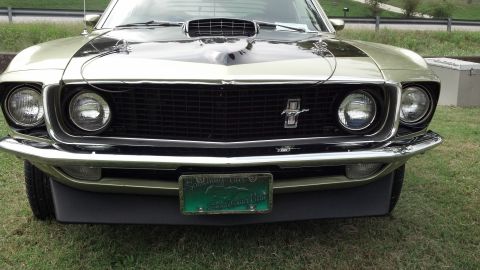 2007 Ford Mustang - Front view of a 1969 Ford Mustang Mach 1, identifiable by its distinctive grille and hood scoop.