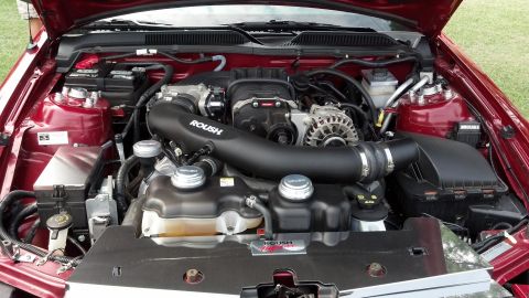 2007 Ford Mustang - Engine bay of a 2007 Ford Mustang, a Roush supercharger and custom intake system.