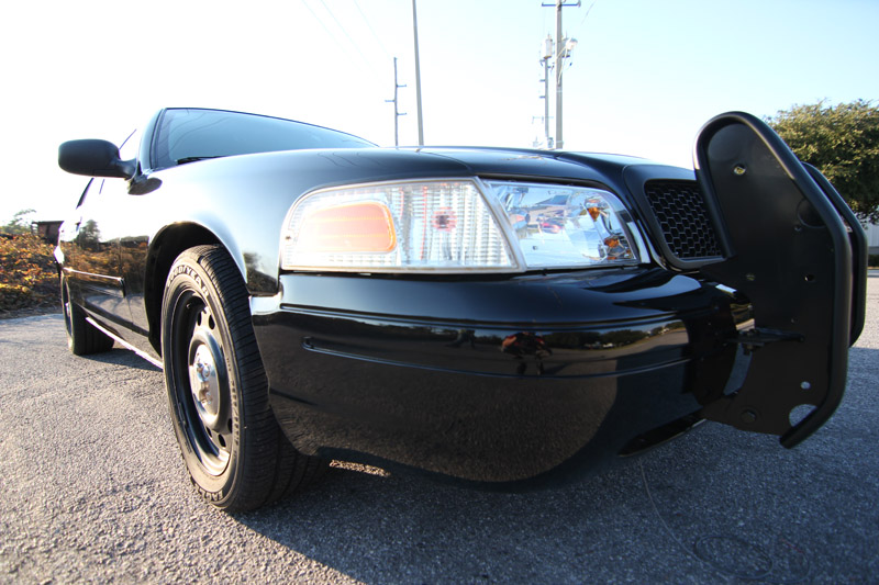 Black 2004 Ford Crown Victoria Police Interceptor with push bumper, front view