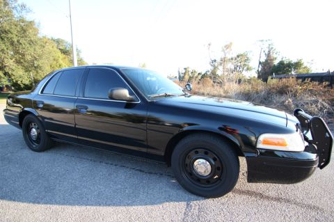 2004 Ford Crown Victoria - This 2004 Ford Crown Victoria police car is shown from the front quarter angle, equipped with a push bar.